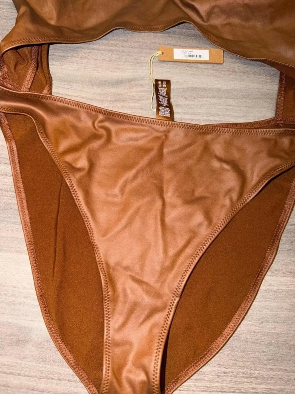 SKIMS Wet Jersey Cutout Bodysuit in the copper PN-BDY-0562 Size M